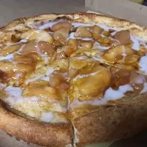 A pizza with apples and ice cream in a box.